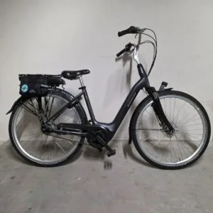 Black Batavus electric city bike with a luggage rack